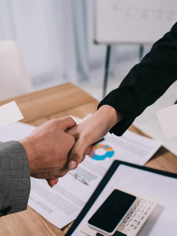 cropped-view-of-business-partners-shaking-hands-an-SUBGQMC.jpg